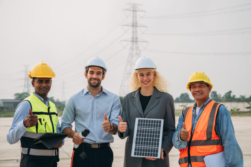 Engineers working on solar installations to create an eco-friendly and renewable power generation. Professionals working outdoors to develop modern and sustainable solar energy solutions.